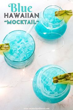 two glasses filled with blue hawaiian mocko cocktails on a marble counter top and the text above it reads, blue hawaiian mocko moctaii