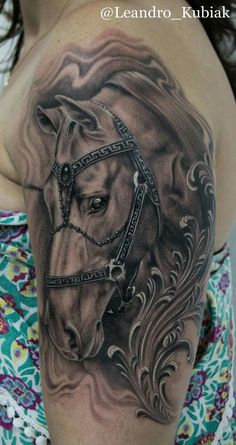 a woman with a horse tattoo on her shoulder