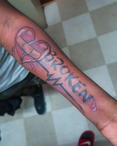 a person with a tattoo on their arm