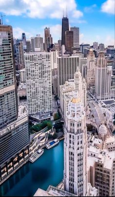 an aerial view of the chicago river and surrounding skyscrapers in this cityscape