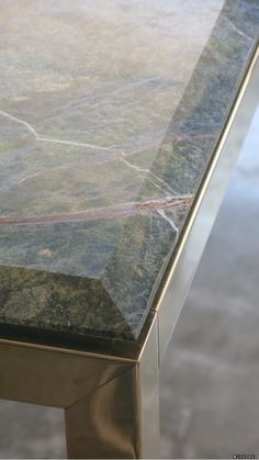 a marble top table with metal legs