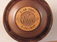 a wooden clock with the words homer engraved on it