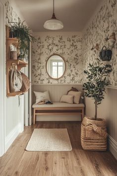 a living room with wooden floors and wallpaper on the walls, along with a round window