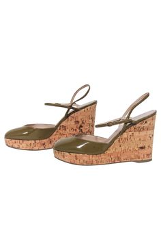 Step into summer with these unique cork wedges from Yves Saint Laurent. Combining a playful style with a boho flair, these round-toe cork wedges are the perfect summer staple. Pair them with a floral dress and oversized sunglasses for a fun and fashionable look! Size 5 (IT 35) Made in Spain Patent leather upper Leather lining Cork wedge Rubber sole Buckle ankle strap Rounded toe Minor blemish on upper Heel height 4" Summer Cork Wedge Heels, Chic Cork Wedge Sandals For Spring, Brown Cork Wedge Sandals For Summer, Summer Brown Cork Wedge Sandals, Chic Cork Heels For Spring, Cork Heels With Wooden Heel And Round Toe, Spring Cork Heels With Round Toe, Spring Cork Wedge Sandals With Round Toe, Cork Wedges