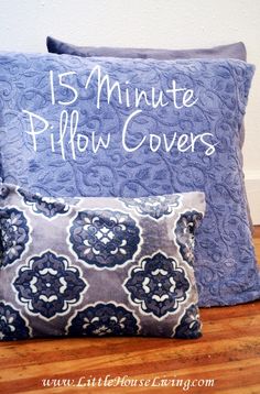 two blue pillows with the words 15 minute pillow covers written in white ink on them