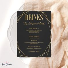 a black and gold wedding menu on a white plate