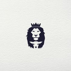 a lion with a crown on it's head is seen in this logo design