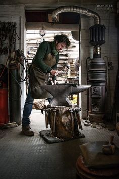 a man working on an object in a workshop