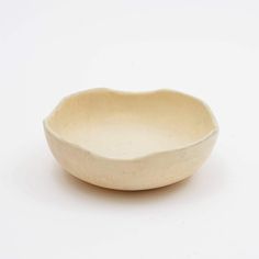 a white bowl sitting on top of a table