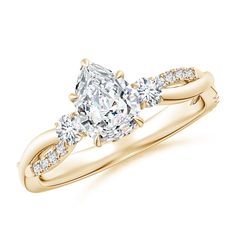 a yellow gold engagement ring with an oval cut diamond in the center and side stones