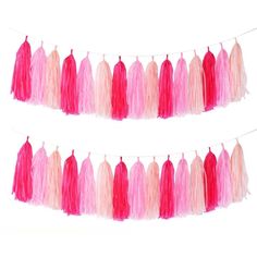 pink and red tissue tassels hanging from a string