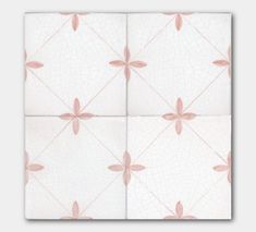 four square tiles with pink flowers on them