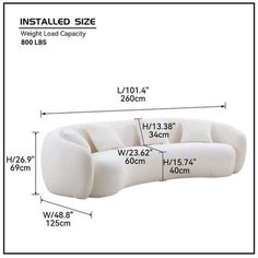 a white couch with measurements for it