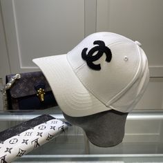 SHOP MORE LUXURY PRODUCTS HERE Description Chanel Cap White Chanel branded Cap with a dynamic and youthful design WhiteWhite FabricCC Logo Includes box, dust bag.This product is of the premium quality. Luxury White Snapback Hat, Designer White Visor Baseball Cap, Designer White Snapback Hat, Designer White Visor Hat, Luxury White Baseball Cap, Trendy White Baseball Cap With Embroidered Logo, Classic White Baseball Cap With Logo Patch, White Baseball Cap With Logo Print And Curved Visor, White Baseball Cap With Logo Print