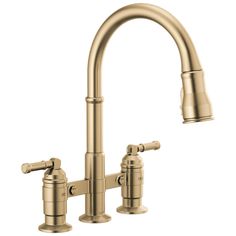 a kitchen faucet with two handles and nozzles