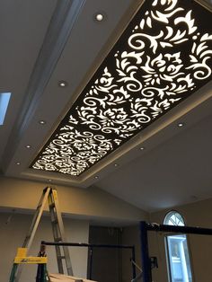 the ceiling is being decorated with intricate designs