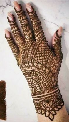 a henna tattoo is shown on someone's hand