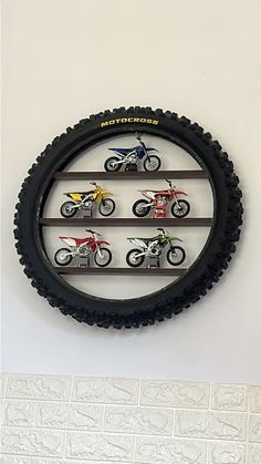 there is a motorcycle display on the wall