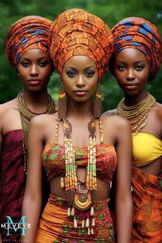 three beautiful african women wearing head wraps and necklaces