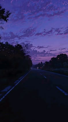 the sky is purple and blue at night