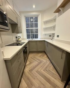 the kitchen is clean and ready for us to use in its new owner's home