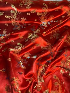 Red dragon print brocade fabric  This is 45 inches wide It is beautiful fabric which can be used for dress making,crafts, decorations upholstery etc It is sold by the mtr. If more than one quantity is bought it will be sent in one continous length All items are brand new Any questions feel free to ask Luxury Red Embroidered Handwork Fabric, Luxury Red Embroidered Fabric For Celebration, Chinese Brocade, Dragon Rouge, Pink Wedding Theme, Elegant Fabric, Beaded Tulle, Gold Dragon, Bridal Fabric