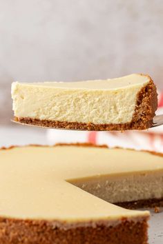 a piece of cheesecake being lifted by a fork