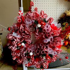 a christmas wreath with candy canes and decorations