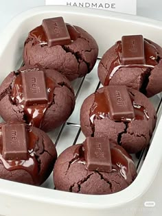 chocolate cookies in a white dish with melted chocolate on top