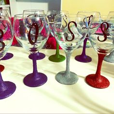 there are many wine glasses that have the letter s on them, all in different colors