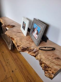 a wooden table with two frames on it