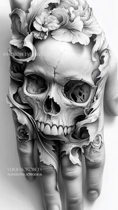 a hand with a skull and flowers on it