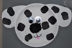 a paper plate with a black and white dalmatian face on it's side