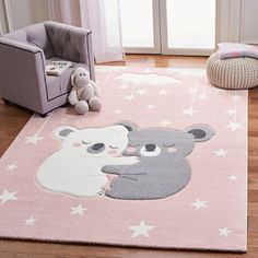 a pink area rug with a koala bear on it and stars in the background