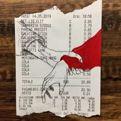 a piece of paper with a hand holding a red umbrella