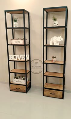 two shelving units with wooden drawers in the middle