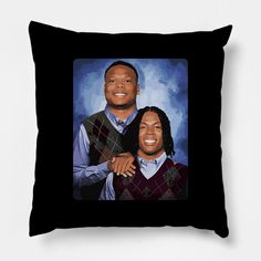 a black pillow with an image of two men smiling and one is holding his arm around the other's shoulder