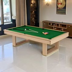 a pool table in the middle of a living room