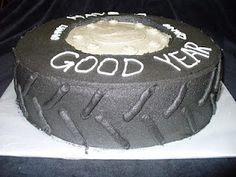 a black cake with white frosting that says good year