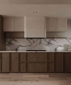 an empty kitchen with marble counter tops and wooden cabinetry, along with wood flooring