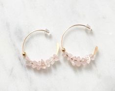 Beautiful Natural Rose Quartz in 18k gold filled half open hoops with rubber backing. So Gorgeous, subtle, feminine, and soft. 💕Rose quartz is the stone of love and romance. Draw in romance with this simple yet elegant, soft, dainty design adds a subtle beauty to your outfit and brings out your skin tone with a sense of femininity with its simplistic elegance. Simple, Dainty, Delicate, yet so Elegant and Romantic. The shine and color are so gorgeous. The picture does not do its justice the piec Delicate 14k Gold Filled Hoop Jewelry, Dainty Rose Gold Hoop Jewelry, Dainty Adjustable Hoop Earrings For Anniversary, Adjustable Dainty Hoop Earrings For Anniversary, Dainty Small Hoop Wire Wrapped Earrings, Wire Wrapped Rose Gold Hoop Jewelry, Rose Gold Wire Wrapped Hoop Jewelry, Delicate Small Hoop Pierced Earrings, Delicate Hoop Jewelry As Gift