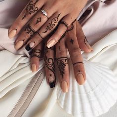 two hands with different designs on them