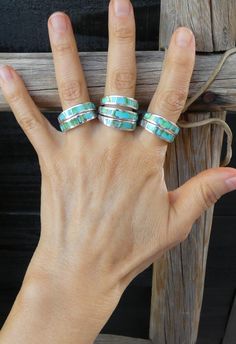 This sleek, gorgeous ring is handcrafted with Sterling Silver and features Sonoran Gold Turquoise inlaid stones. The sleek and smooth Navajo inlay design is a creative element that gives the piece its own unique flair! This ring has all the same precision and delicacy that the Navajo silversmiths are known for.  Let me know your size at checkout Choose your size at checkout (Sizes 7, 7.5, 8.5, 9.5) Width: 1/4" 4 grams Stamped: Sterling Artist Stamped: AT  This ring can be sized up or down by two sizes for an additional $25 fee. Ring Sizings take approximately 2 weeks turnaround. Add the following listing ID to your cart (253475134610) and send a note with the size you need. Send a message if you have questions. Please use the following link to add to your shopping cart at the time of purch Gorgeous Ring, Turquoise Ring Silver, Wide Band Rings, Matching Bracelet, Matching Bracelets, Me Clean, Native American Jewelry, Band Ring, Band Rings