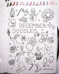 a notebook with doodles written in it and christmas decorations on the cover, along with other holiday related items