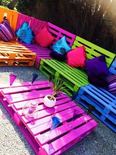 colorful wooden pallets are arranged on the ground