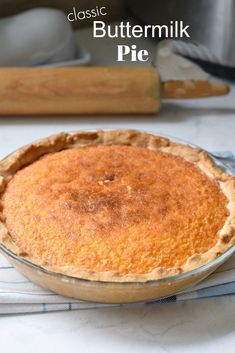 an old fashioned buttermik pie sitting on top of a blue and white towel