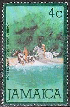 jamaica postage stamp with two men on horses in the water and trees behind them,