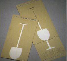 two cards with the words groundbreaking and a wine glass on them are sitting next to each other