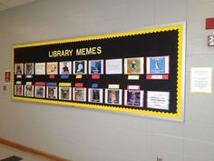 the library memes display is on the wall in front of the door to the hallway