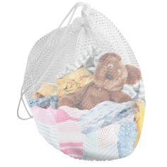 a white mesh bag with a brown teddy bear on it's chest and clothes inside